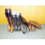 Four pairs of good quality lady's boots to include Hunter Wellies, Next and similar