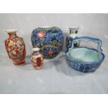 A collection of oriental ceramics to include a ginger jar four panel marks to the base, a pair of