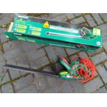 A Qualcast 450 watt electric hedge trimmer, in original box (nominal use only)
