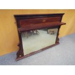 An Edwardian mahogany framed over- mantle mirror