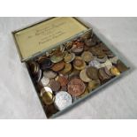 Numismatology - A Coronation tin containing a collection of predominantly pre decimal UK and World