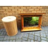 A wooden clothes basket lidded barrel, 65cm (h) x 45cm (diam) and a mirror with pine surround and