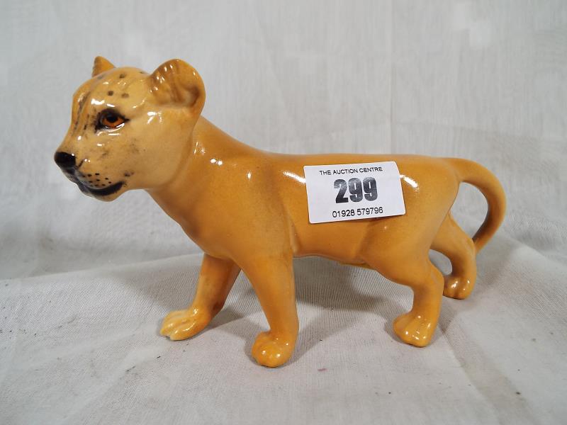 A Beswick pottery figurine depicting a lion cub facing right - 1508, 10.1 cm (h) - Estimate £20 -