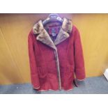 A Dennis by Dennis Basso three quarter length lady's red jacket with silt pocket 100cm (h) , size