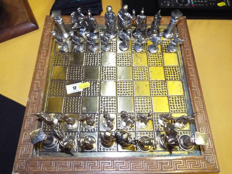 A chessboard and a complete set of chess pieces