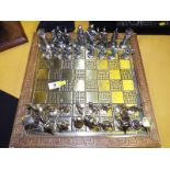 A chessboard and a complete set of chess pieces