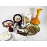 A good mixed lot to include a Carnival glass bowl, a twin handled art glass vase, a Royal Doulton