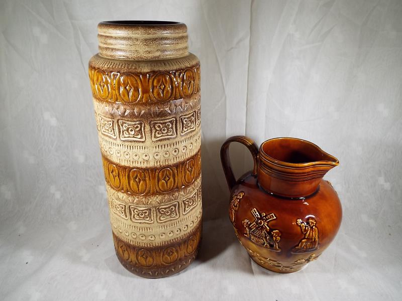 An Arthur Wood six pint Lambeth jug with relief decoration 22 cm (h) and a West German cylindrical - Image 2 of 2