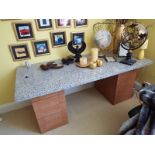 A granite top pedestal desk