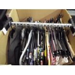 A transporter clothes rail containing a collection of good quality lady's clothes to include