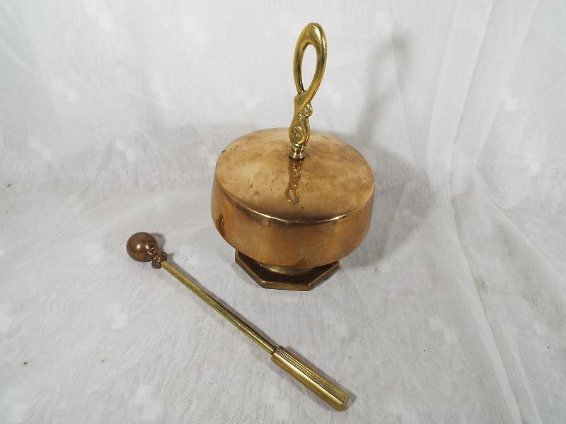 A brass gong with striker,