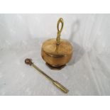 A brass gong with striker,