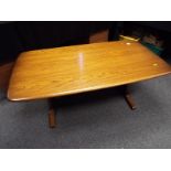 An Ercol rectangular coffee table 51 cm (h) x 130 cm (w) x  69 cm (d)