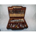 A good quality mahogany case containing a collection of plated cutlery, some with bone handles,