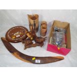 A good mixed lot to include African carved elephants, wall plaque with inlaid decoration, boomerang,