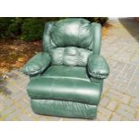 A green leather recliner with multi massage facility