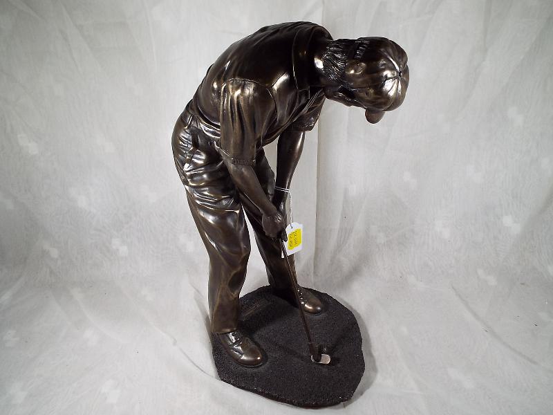 A bronzed figurine depicting a golfer, signed to the base, - Image 2 of 3