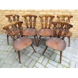 Six Ercol dining chairs decorated in the Fleur de Lis pattern