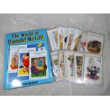 A collection of comical postcards to include Donald McGill and a hardback book entitled The World