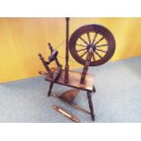 An oak spinning wheel and a weaving shuttle