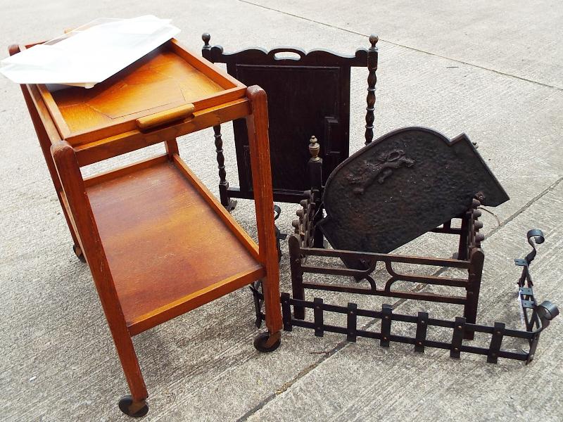 A wooden tea trolley with integral tray,