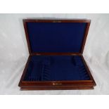 A mahogany cased canteen of cutlery,