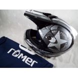 A Romer helmet with soft bag,