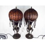 A pair of good quality, ornate table lamps with balloon shaped glass shades,