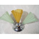 An Art Deco epergne with three coloured glass flutes on a plated base,