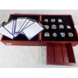 An Everton Football Club pin collection box containing 11 pin padges,