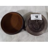 A snuff box with screw release lid bearing eagle and the Third Reich symbol
