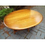 An oval drop leaf table by Ercol 49cm (h) x 107cm (w) x 41cm (d) opening to 93cm