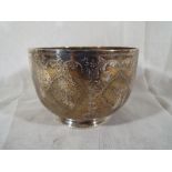 A Victorian silver pedestal bowl with floral and scrolled decoration throughout, London assay 1885,