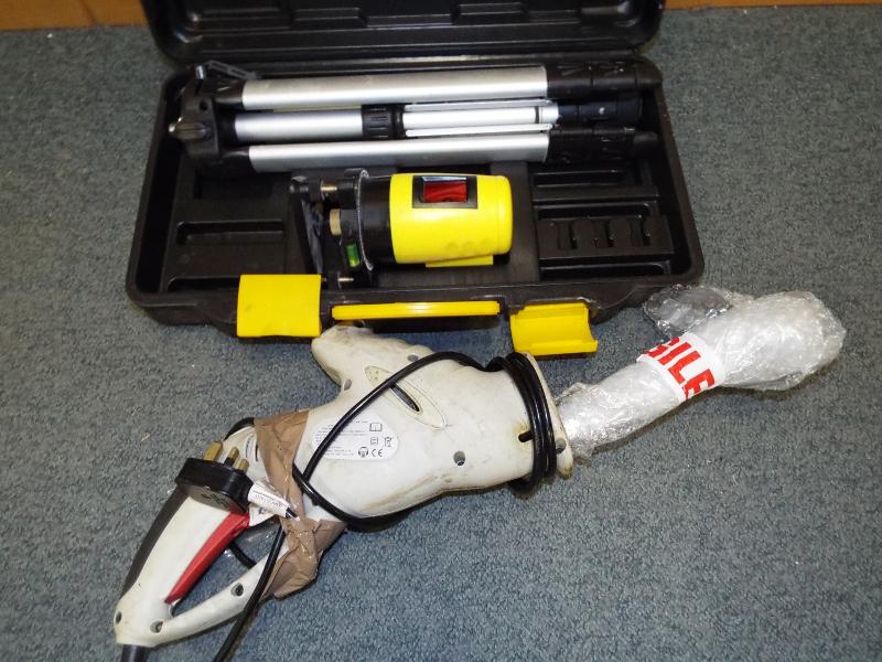 A Performance Power 500W multi - function saw and a surveyors measure with tripod stand and cased