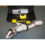 A Performance Power 500W multi - function saw and a surveyors measure with tripod stand and cased