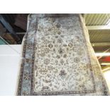 A Beluchi rug, with an ivory ground,