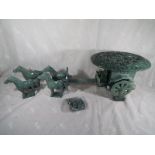 An oriental carved jadeite horse drawn carriage with relief decoration to the roof depicting a