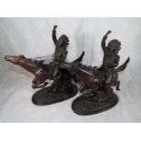 Two bronzed figurines depicting Native Americans mounted on horseback,