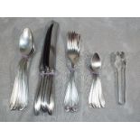 A collection of WMF silver plated tableware comprising four forks, three knives, five table spoons,