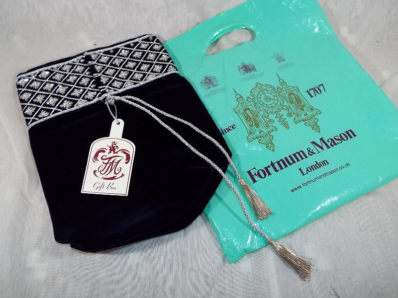 A Fortnum & Mason of London champagne velvet bag