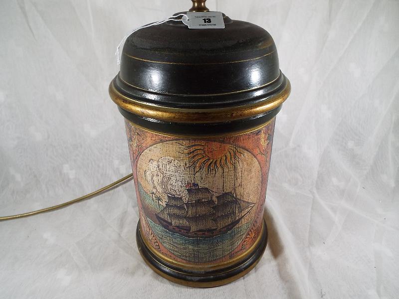 An unusual table lamp decorated with a depiction of a clipper,