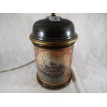 An unusual table lamp decorated with a depiction of a clipper,