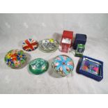A collection of paperweights to include iridescent, Union Jack, millefiore flowers,