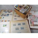 Philately - three albums of early 20th century and later UK and World postage stamps and a further