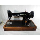 A vintage Singer electric sewing machine serial number EA380841