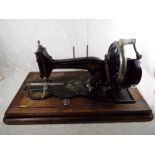 A vintage hand cranked sewing machine,