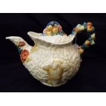 A Clarice Cliff lidded teapot decorated in Celtic Harvest pattern 15.