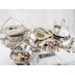 A collection of good quality silver plated ware to include serving dishes, a candlestick,