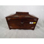 A 19th century rosewood sarcophagus tea caddy with inlaid mother of pearl decoration,
