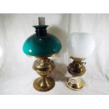 An oil lamp with glass funnel and diffuser,